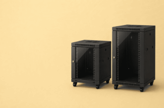 Two black equipment rack cabinets on casters against a pale yellow background